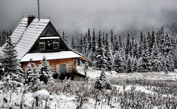 Picture of cabin on mountain in snow