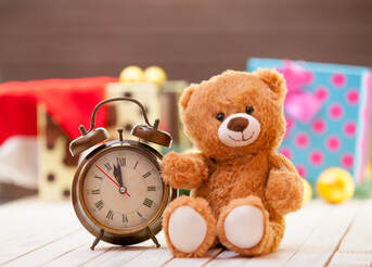 Picture of alarm clock and teddy bear