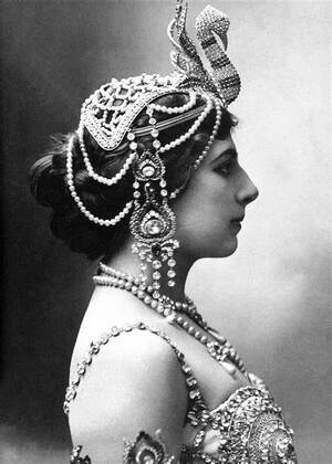 Side view of Mata Hari in jeweled headdress