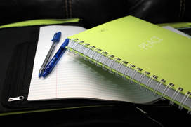 Picture of spiral notebook and pens