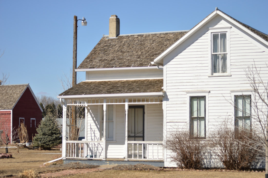 Picture of white two-story farmhouse