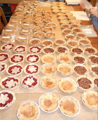 Picture of table covered with small pies