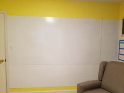 Picture of large whiteboard on wall